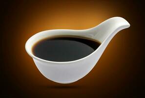 Soy sauce in bowl isolated, shoyu closeup in dish photo