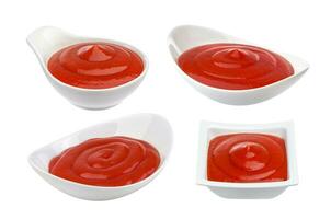 Tomato ketchup in bowl isolated on white photo