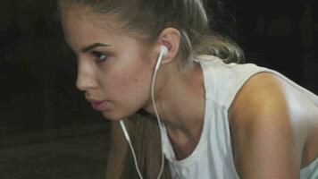 Close up shot of a sporty woman doing donkey kicks exercise video