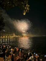 colorful fireworks in the night sky on the seafront of Alicante spain photo