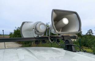 Car with megaphones on the roof. Advertising car with big speakers on roof. Car sound system for audio advert. photo