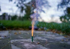 Little green fountain fireworks. Firecrackers shooting. photo