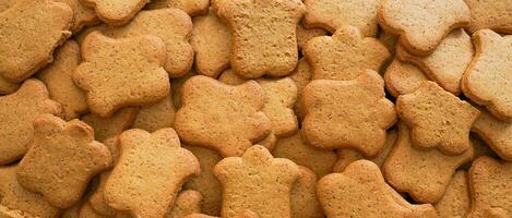 Gingerbreads. Christmas background of bell shaped ginger breads. Christmas cookies and candies. photo