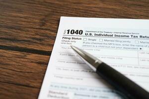 Tax form 1040 U.S. Individual Income Tax Return, business finance concept. photo