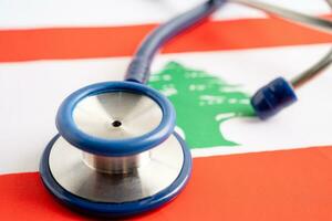 Stethoscope on Lebanon flag background, Business and finance concept. photo