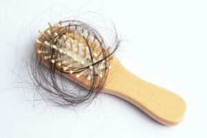 Hair loss fall with comb bush serious problem health, beauty and cosmetic concept. photo