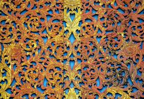 an ornate wooden wall with intricate designs photo