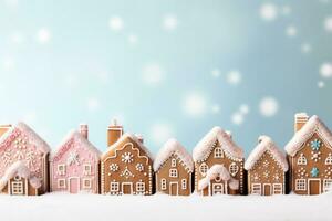 Christmas gingerbread houses in pastel shades background with empty space for text photo