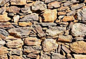 a wall made of rocks and stones photo