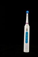 a white electric toothbrush photo