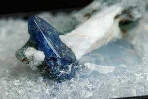 macro mineral stone Benitoite on a black background photo