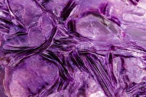 Macro stone mineral Charoite on a white background photo