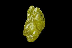 Macro mineral sulfur stone on a black background photo