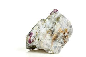 Macro mineral stone Ruby in rock on white background photo