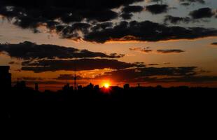 Autumn red sunset with a purple sky photo