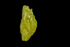 Macro mineral sulfur stone on a black background photo