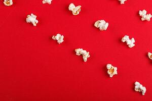 popcorn macro on a red background photo