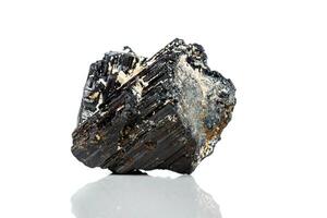 macro mineral stone sherle, schorl, black tourmaline on white background photo