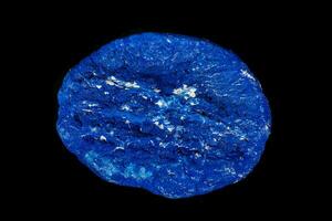 Macro mineral stone Azurite in siltstone against black background photo