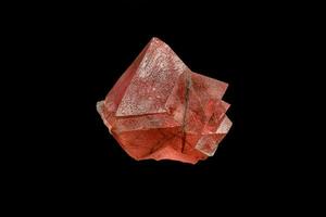 macro mineral stone pink fluorite on a black background photo