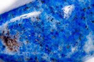 Macro mineral stone blue lapis lazuli afghanistan on white background photo