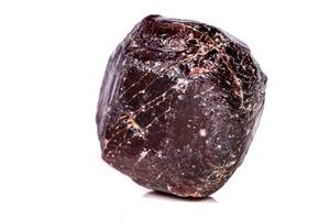 Macro of a mineral garnet stone on a white background photo