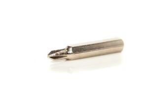 A set of different attachments for a head screwdriver with a screwdriver on a white background photo