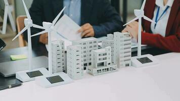 Business team people meeting and talking with engineer and architecture about planning and drawing of building construction project, smart executive professional working at outdoor, teamwork concept video