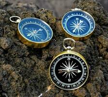 Compasses on a rock photo