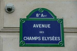 A sign that says Avenue Des Champs Elysees photo