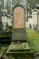 a tombstone in a cemetery photo