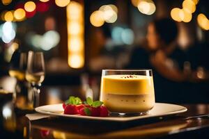 A dessert on a plate with a glass of wine photo