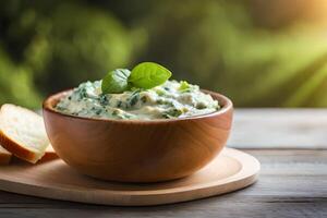 The image is a close up of a creamy dip made with spinach and artichoke, and there is a bright light shining in the background photo