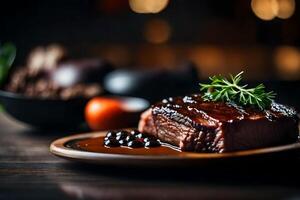 In the picture, the main food that catches attention is a plate with beef and a sauce made from black beans It is difficult to see what is on the opposite side of something photo