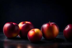 Take a close look at nectarines in a photography studio with a black background photo