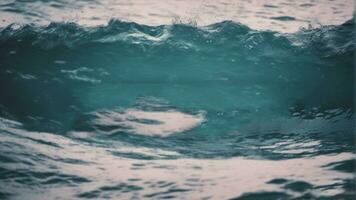 de cerca marina superficie de azul mar agua con pequeño onda ondas. generado por ai foto