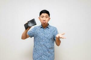 Asian poor man gesture shake his wallet find money feels sad isolated photo