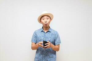 Positive asian man blue shirt wear hat holding wallet amazed isolated photo
