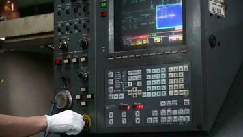 CNC machine operator press the button to turn off the machine when faulty. video