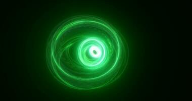 Abstract green rings spheres from energy magic waves of smoke circles and glowing lines on a black background photo