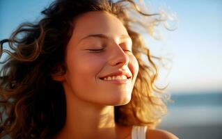 Young woman breathing fresh air in the beach. photo