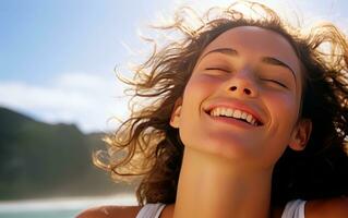 Young woman breathing fresh air in the beach. photo