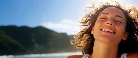 Young woman breathing fresh air in the beach. photo