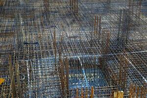 Billets of reinforcement at the construction site. New construction. Reinforced concrete construction. photo