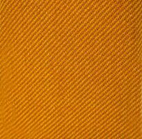 Yellow carbon fabric material texture and textile background. photo