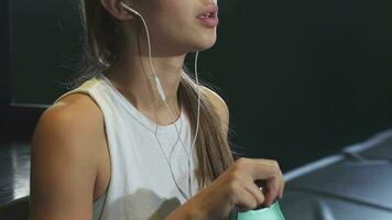 Cropped close up of a sportswoman with sexy lips drinking water video