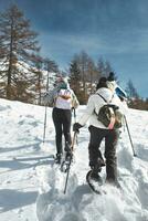 Three friends' snowshoe outing photo