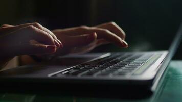 Female hands write text messages on a laptop keyboard close-up. Busy business woman emailing a client using a digital wireless handheld device remotely. Software, online education, apps, concept video