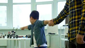 Boy points his hands on toys video