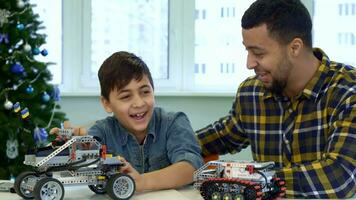 Father and son play with toy SUV video